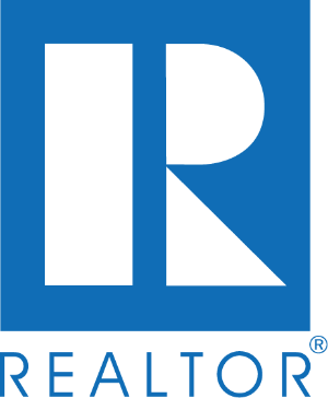 A blue and green logo for realtor. Com